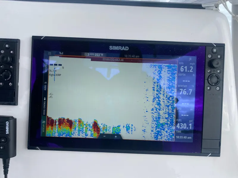 Slide: The Image of Simrad marine display on 2022 Front Runner 36 cc boat, showing sonar data and navigation details. - 13