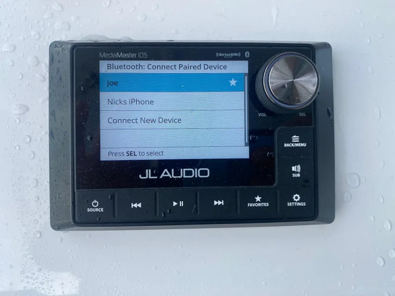 Slide: The Image of JL Audio MediaMaster display on a 2022 Front Runner 36 cc, showing Bluetooth device options. - 15