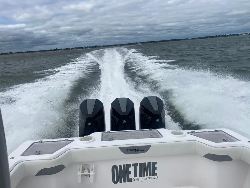 Slide: The Image of 2022 Front Runner 36 cc boat speeding on water, leaving a wake behind. - 7