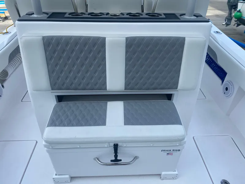 Slide: The Image of Front Runner 36 cc 2022 boat seating with gray and white cushioned design. - 8