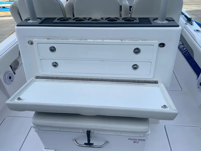 Slide: The Image of 2022 Front Runner 36 cc boat with storage drawers and cooler. - 9