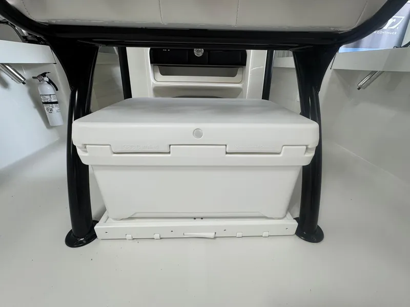 Slide: The Image of 2025 Parker 23SE Center Console boat interior with white storage compartment. - 11