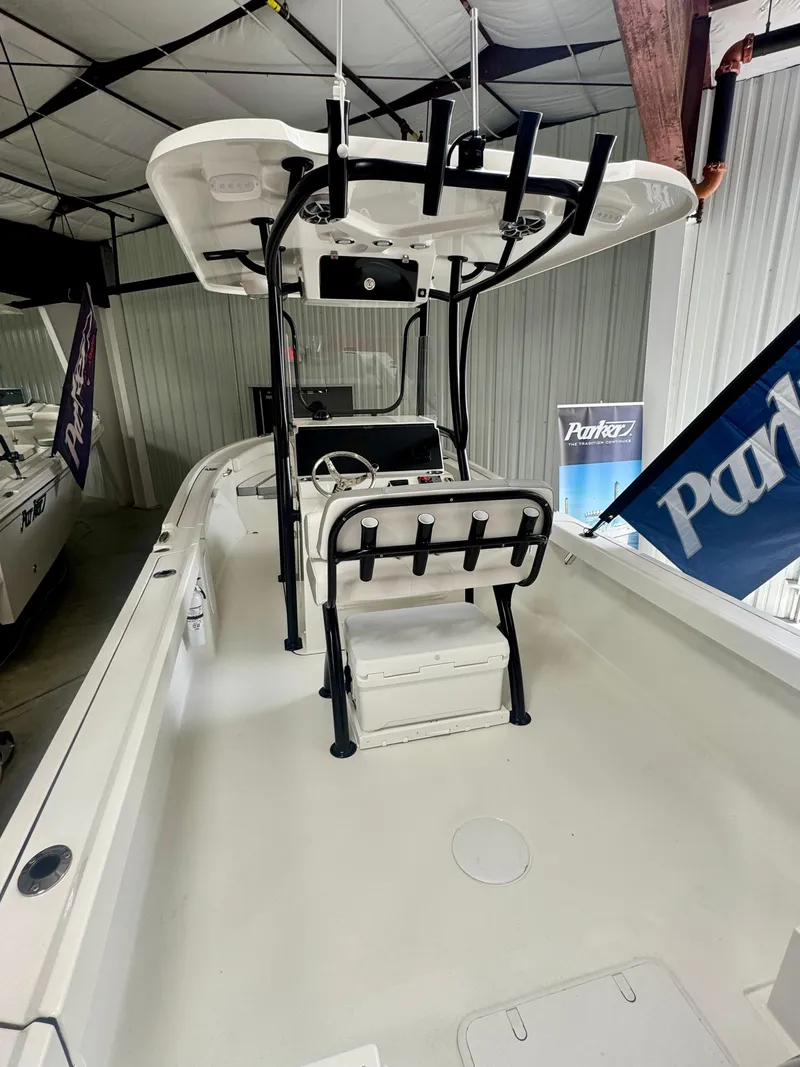 Slide: The Image of 2025 Parker 23SE Center Console boat in showroom, featuring sleek design and modern amenities. - 5