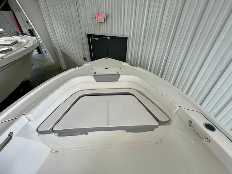 Slide: The Image of 2025 Parker 23SE Center Console boat interior with cushioned seating and sleek design. - 9