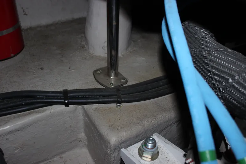 Slide: The Image of Engine room detail of a 2017 Sea Ray Sundancer 400, showing cables and metal fittings. - 13