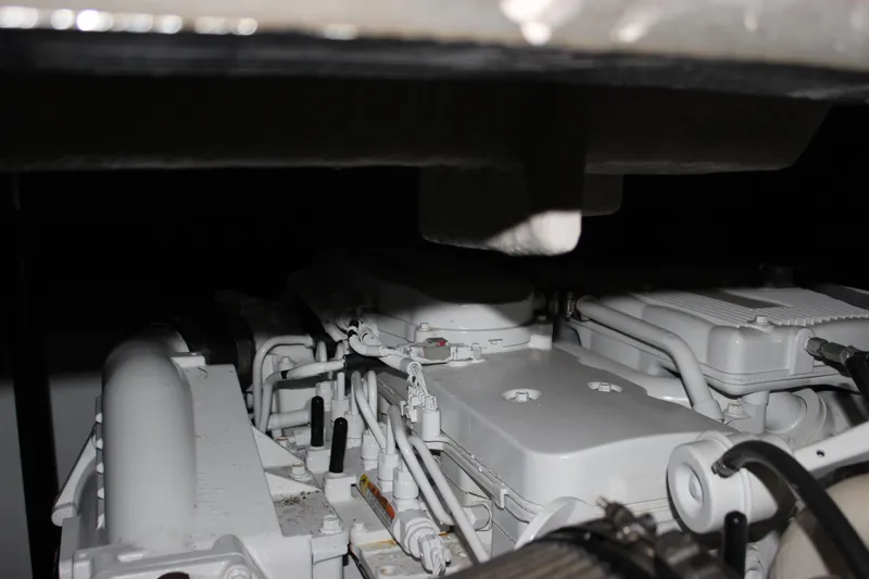 Slide: The Image of Engine compartment of a 2017 Sea Ray Sundancer 400 yacht, showcasing mechanical components. - 14