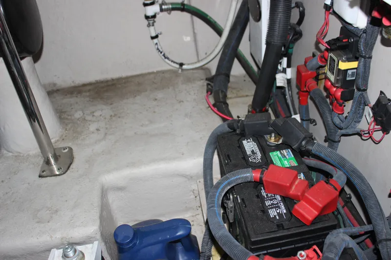 Slide: The Image of Engine compartment of a 2017 Sea Ray Sundancer 400 with battery and wiring. - 15