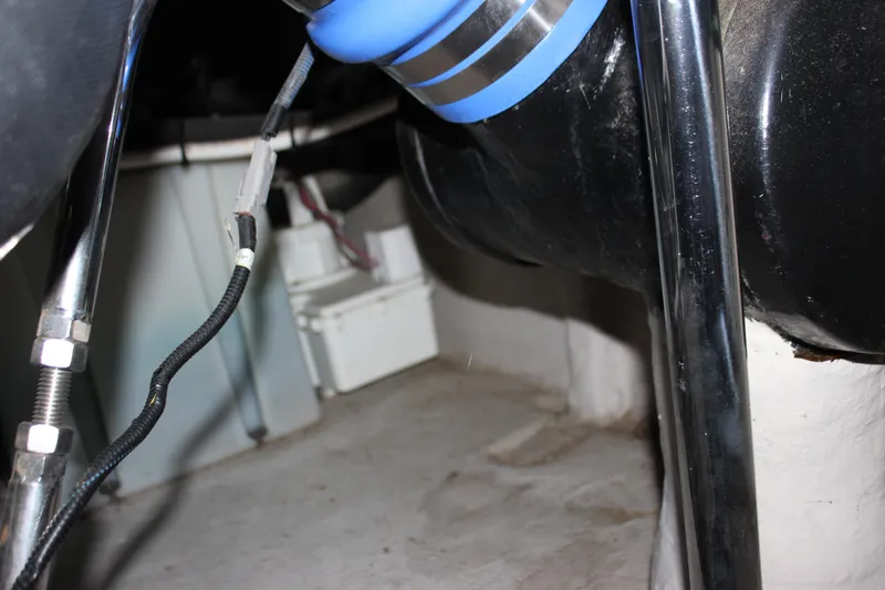 Slide: The Image of Engine compartment of a 2017 Sea Ray Sundancer 400 boat, showing hoses and wiring. - 19