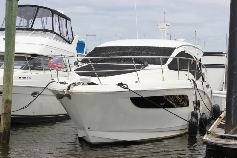 Slide: The Image of 2017 Sea Ray Sundancer 400 yacht docked at marina, featuring sleek design and modern amenities. - 2