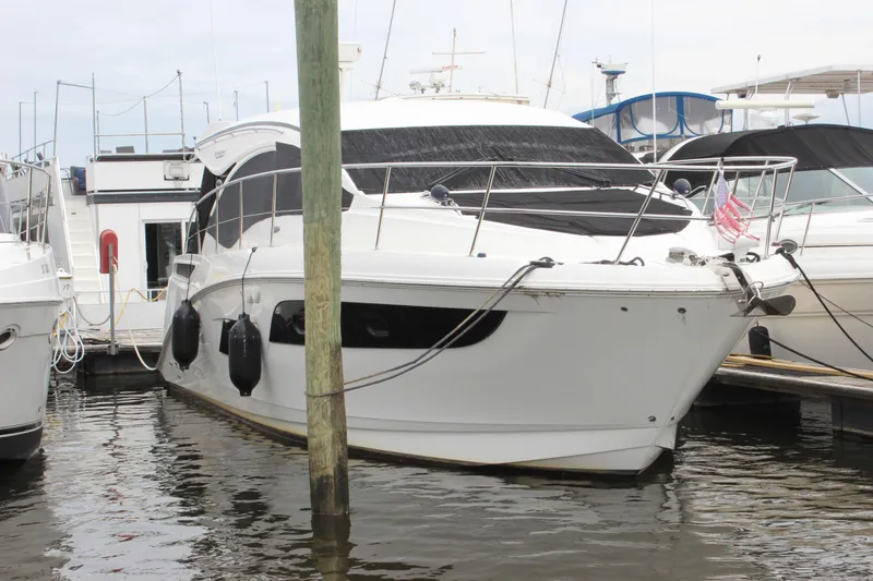 Slide: The Image of 2017 Sea Ray Sundancer 400 yacht docked at marina, featuring sleek design and modern amenities. - 22