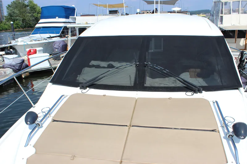 Slide: The Image of 2017 Sea Ray Sundancer 400 yacht docked, featuring a spacious sun deck and sleek design. - 31