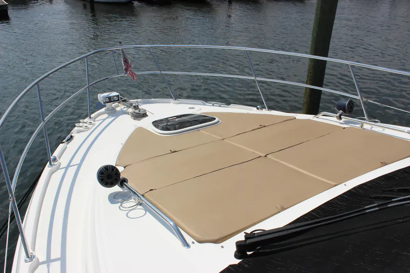 Slide: The Image of 2017 Sea Ray Sundancer 400 yacht with spacious sunbathing deck on calm water. - 32