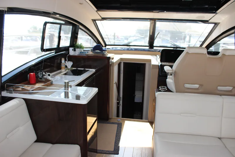 Slide: The Image of Interior of 2017 Sea Ray Sundancer 400 yacht with modern kitchen and seating area. - 34