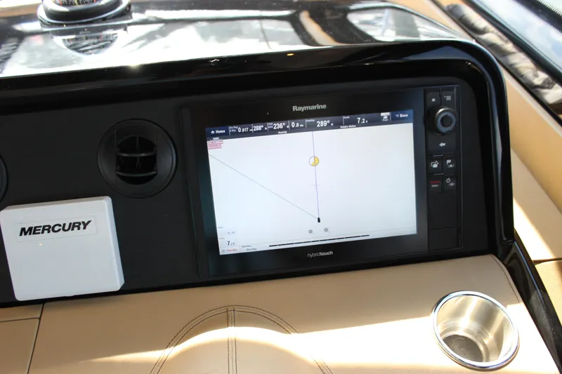 Slide: The Image of Dashboard of 2017 Sea Ray Sundancer 400 with Raymarine navigation display. - 38