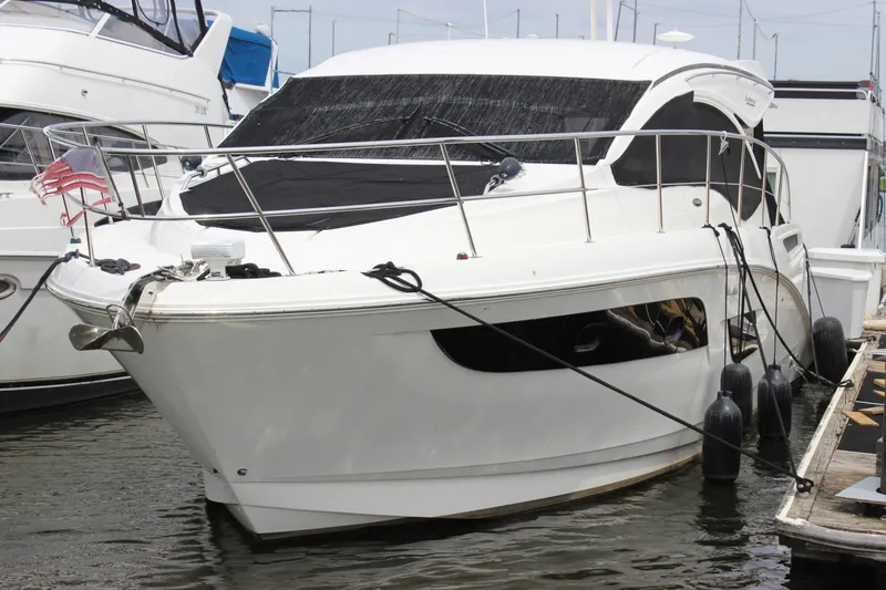 Slide: The Image of 2017 Sea Ray Sundancer 400 yacht docked at marina, front view. - 4