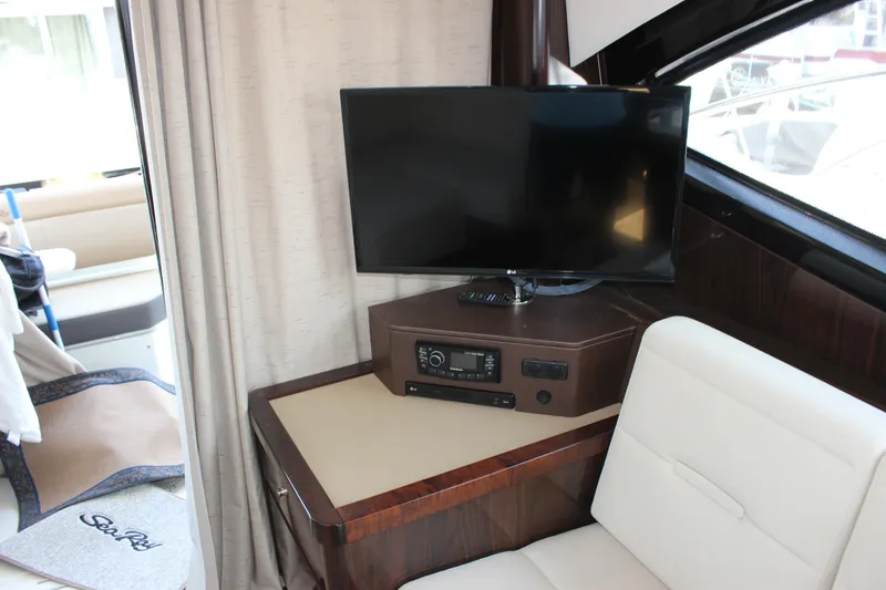 Slide: The Image of Interior of 2017 Sea Ray Sundancer 400 with TV and seating area. - 42