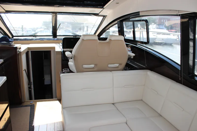 Slide: The Image of Interior of 2017 Sea Ray Sundancer 400 yacht with white seating and helm station. - 45