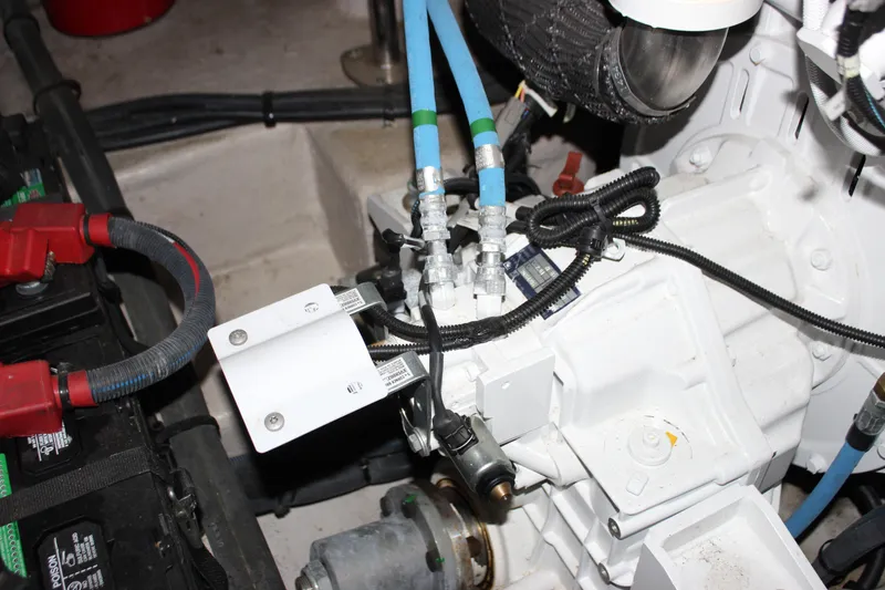 Slide: The Image of Engine compartment of 2017 Sea Ray Sundancer 400 with visible wiring and components. - 8