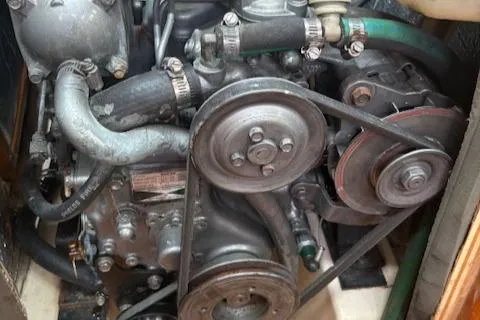 Slide: The Image of Engine of a 2001 Hunter 340 sailboat, showing belts and hoses. - 22