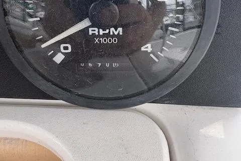 Slide: The Image of Close-up of a 2001 Hunter 340 RPM gauge displaying 6700 RPM. - 29