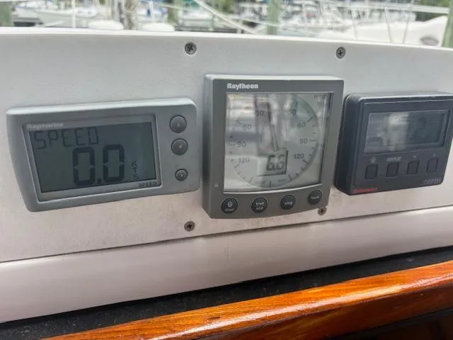 Slide: The Image of Boat instrument panel on a 2001 Hunter 340, displaying speed and navigation data. - 3