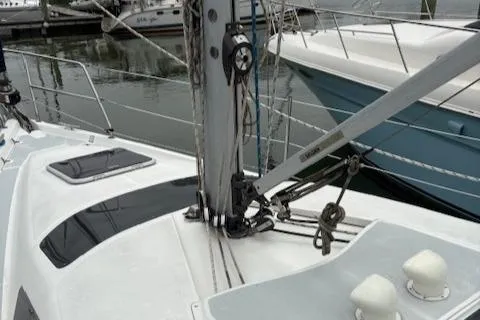 Slide: The Image of 2001 Hunter 340 sailboat deck with rigging and mast in marina setting. - 30