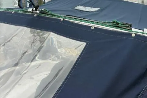 Slide: The Image of Blue canvas cover on a 2001 Hunter 340 sailboat with clear window panel. - 33
