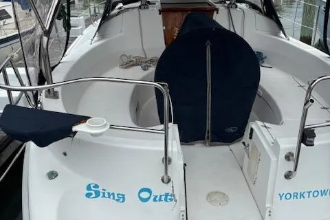 Slide: The Image of 2001 Hunter 340 sailboat cockpit with "Sing Out" and "Yorktown" text. - 5