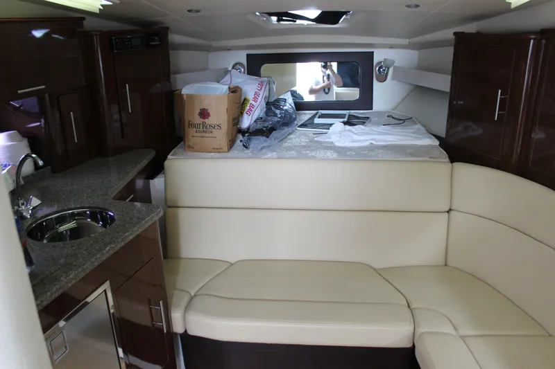 Slide: The Image of Interior of 2014 Regal 35 Sport Coupe with kitchenette and seating area. - 12