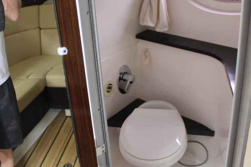 Slide: The Image of 2014 Regal 35 Sport Coupe bathroom interior with toilet and seating area. - 34