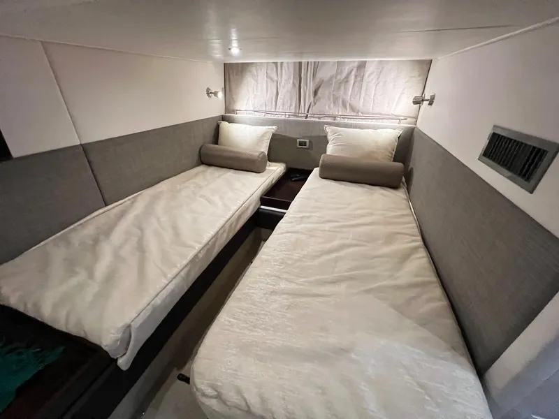 Slide: The Image of Twin cabin beds in 2017 Sea Ray Sundancer 400 yacht, featuring modern design and cozy ambiance. - 18