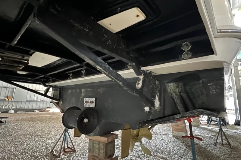 Slide: The Image of 2017 Sea Ray Sundancer 400 boat hull on stands in a storage facility. - 25