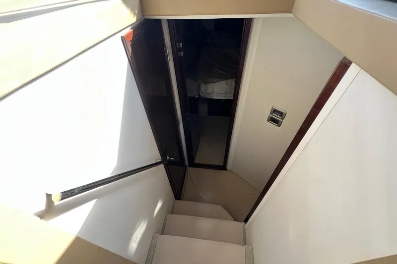 Slide: The Image of Staircase leading to cabin in 2017 Sea Ray Sundancer 400 yacht interior. - 29