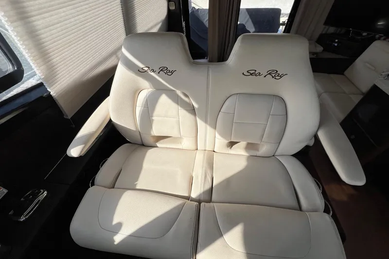 Slide: The Image of 2017 Sea Ray Sundancer 400 interior with plush beige seating. - 32
