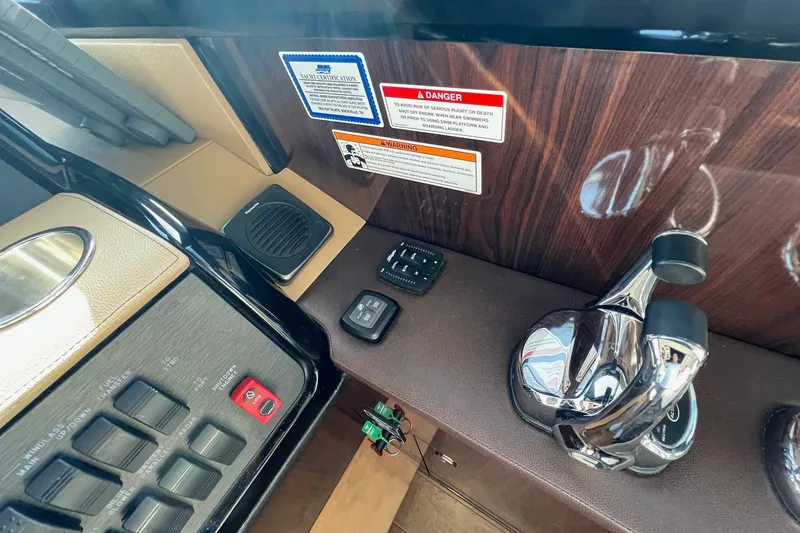 Slide: The Image of Control panel of 2017 Sea Ray Sundancer 400 yacht with switches and throttle. - 34