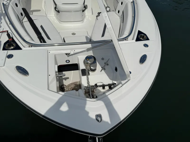 Slide: The Image of 2023 Blackfin 252 CC boat bow with anchor storage and seating area. - 13