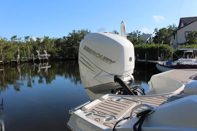 Slide: The Image of 2019 Crownline Eclipse E285 XS boat with Mercury outboard motor on a calm waterway. - 1