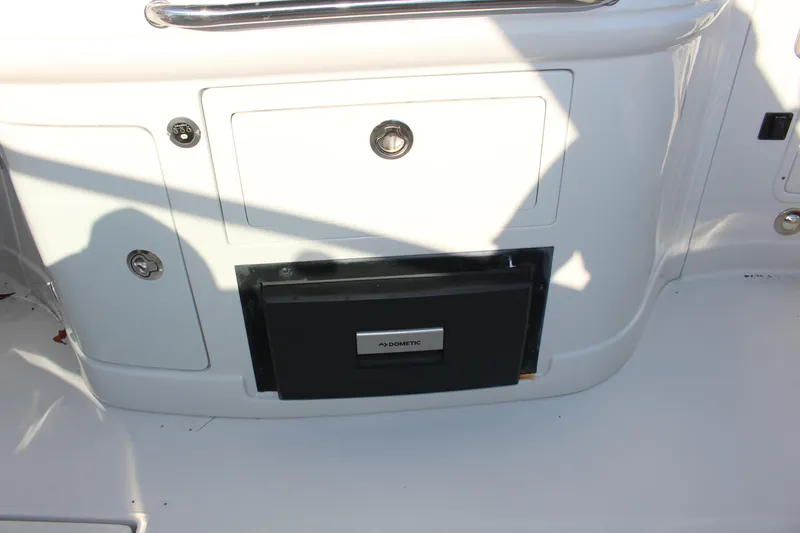 Slide: The Image of 2019 Crownline Eclipse E285 XS boat storage compartment with secure lock. - 12