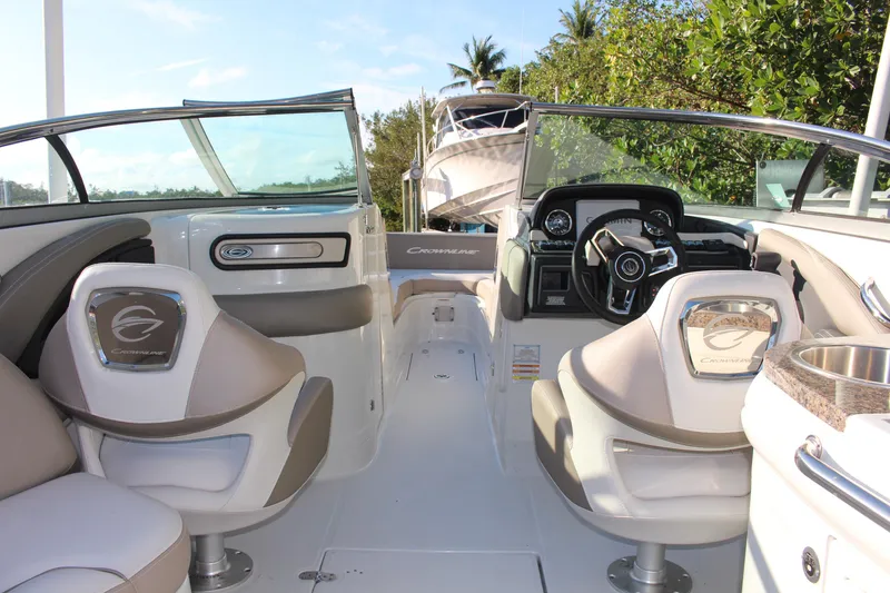 Slide: The Image of 2019 Crownline Eclipse E285 XS boat interior with modern seating and steering console. - 4
