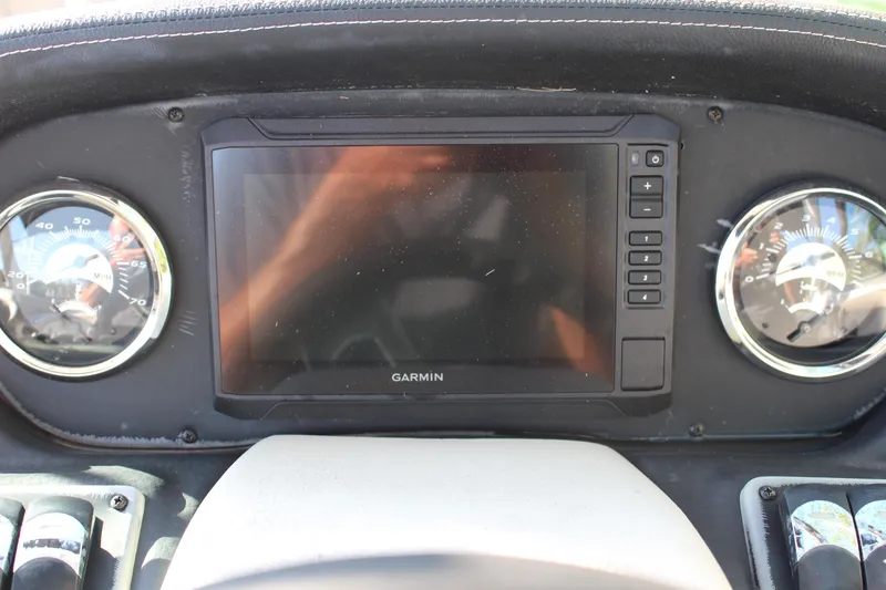 Slide: The Image of Dashboard of 2019 Crownline Eclipse E285 XS with Garmin display and gauges. - 7