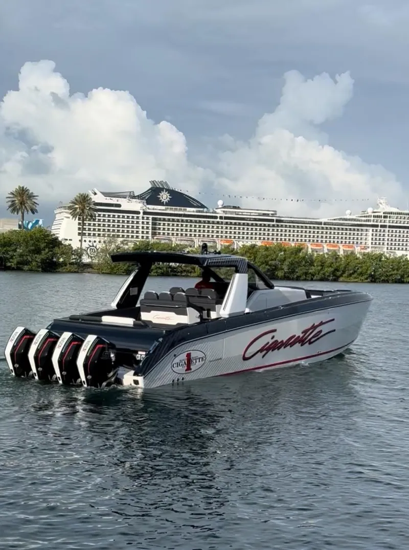 Slide: The Image of 2024 Cigarette 42 Auroris boat with four engines on a scenic waterway. - 4