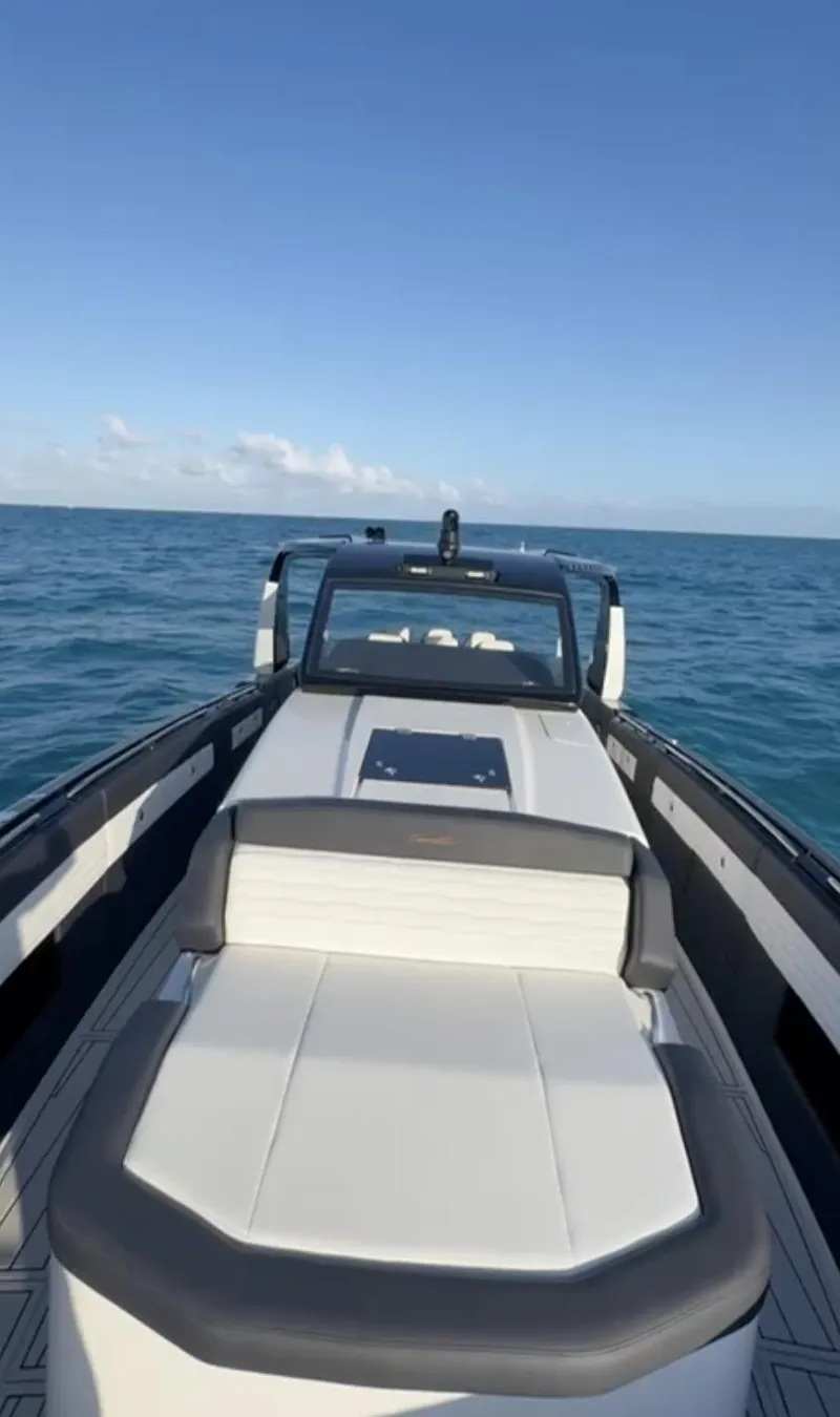 Slide: The Image of 2024 Cigarette 42 Auroris boat cruising on open sea under clear blue sky. - 5