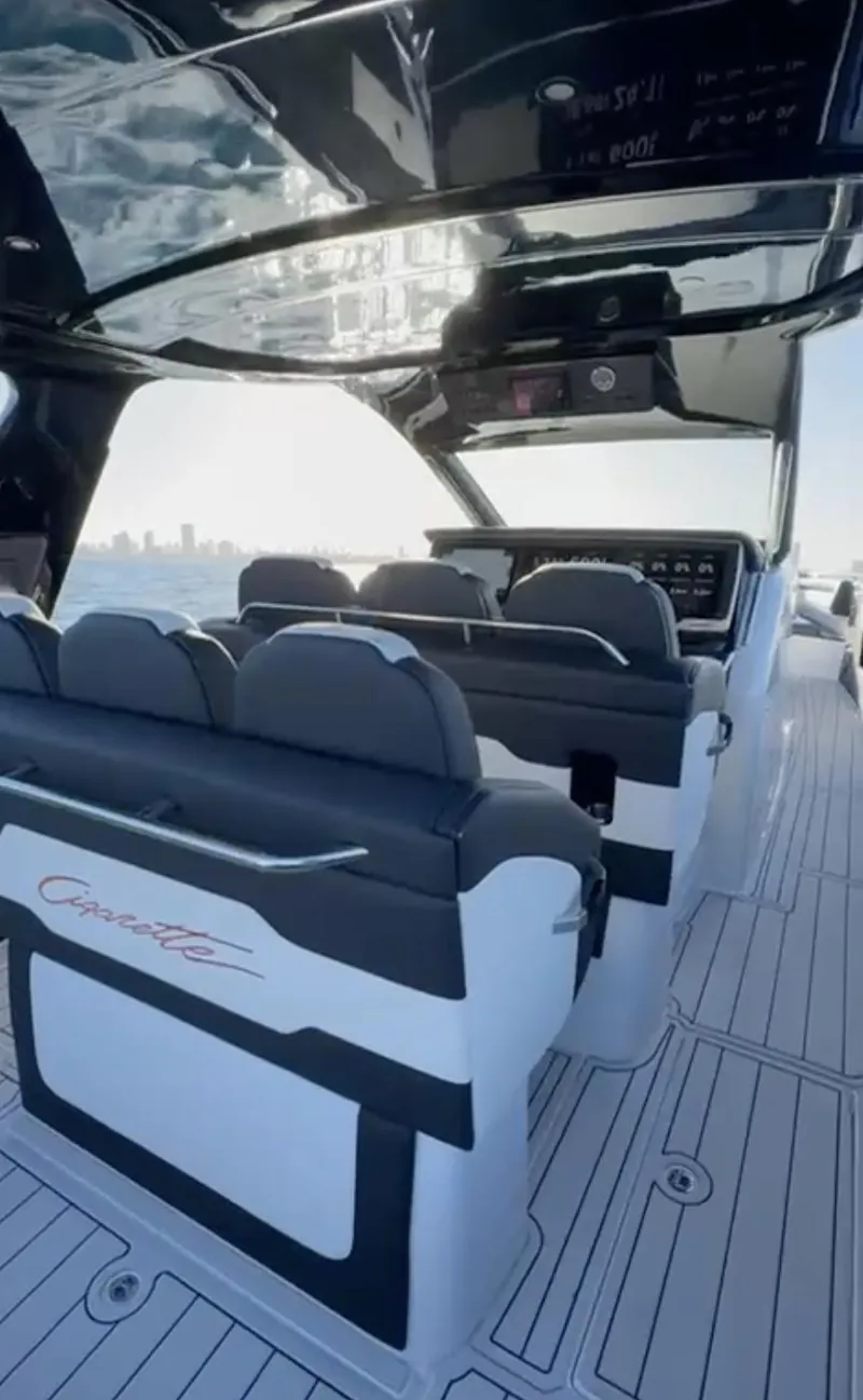Slide: The Image of 2024 Cigarette 42 Auroris luxury boat interior with sleek seating and modern design. - 6