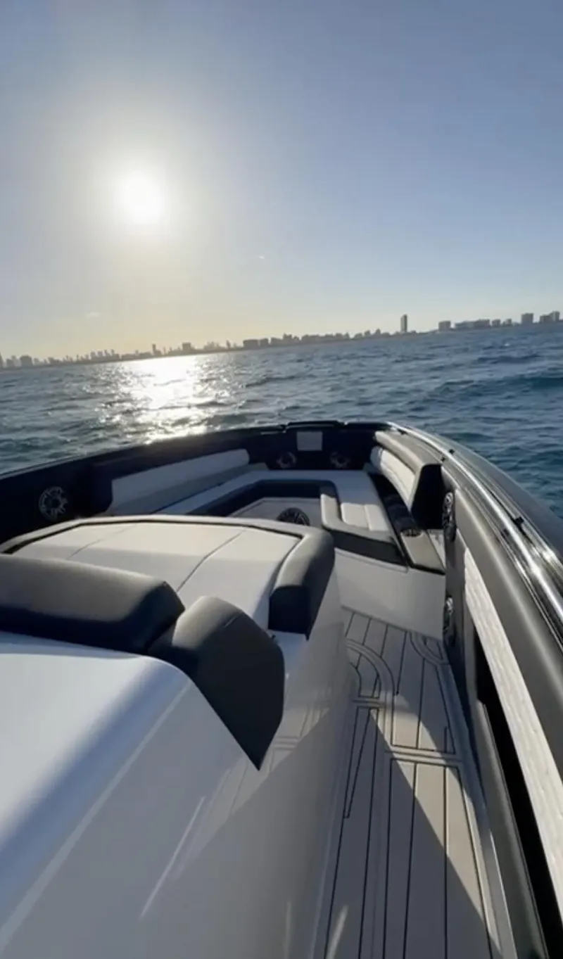 Slide: The Image of 2024 Cigarette 42 Auroris boat cruising on sunny ocean waters. - 8