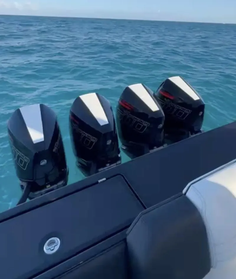 Slide: The Image of 2024 Cigarette 42 Auroris boat with four powerful outboard engines on open water. - 9