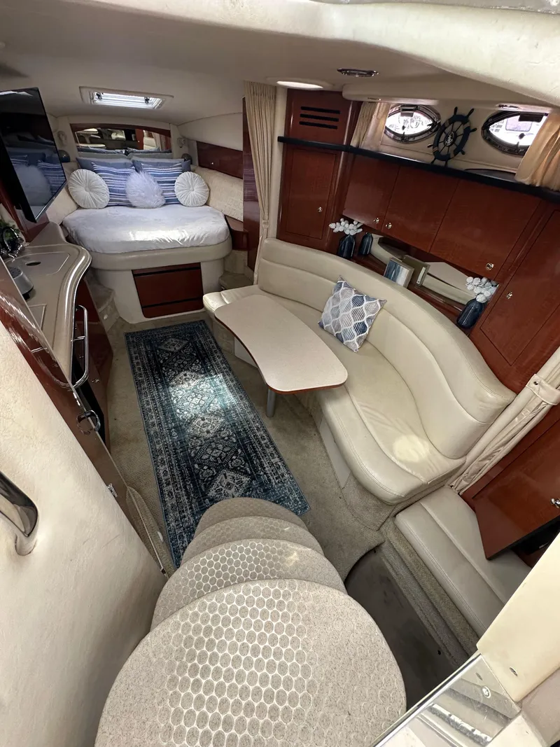Slide: The Image of Luxurious interior of 2003 Sea Ray 320 Sundancer yacht with cozy seating and elegant decor. - 27