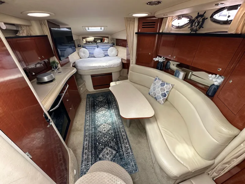 Slide: The Image of Luxurious interior of a 2003 Sea Ray 320 Sundancer yacht with elegant seating and decor. - 28