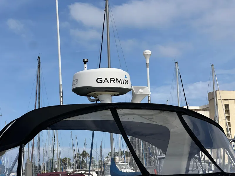 Slide: The Image of Radar equipment on 2003 Sea Ray 320 Sundancer boat with Garmin system, marina background. - 3