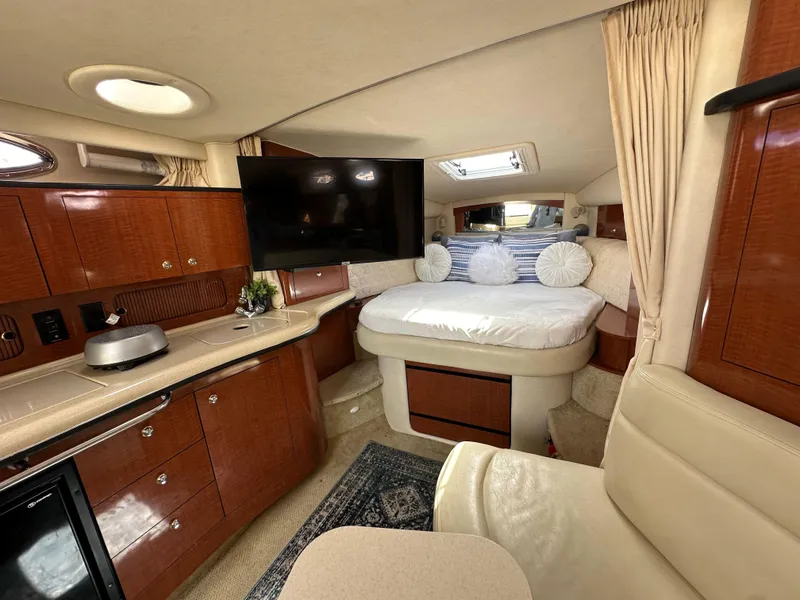 Slide: The Image of Interior of 2003 Sea Ray 320 Sundancer yacht with cozy cabin and modern amenities. - 36