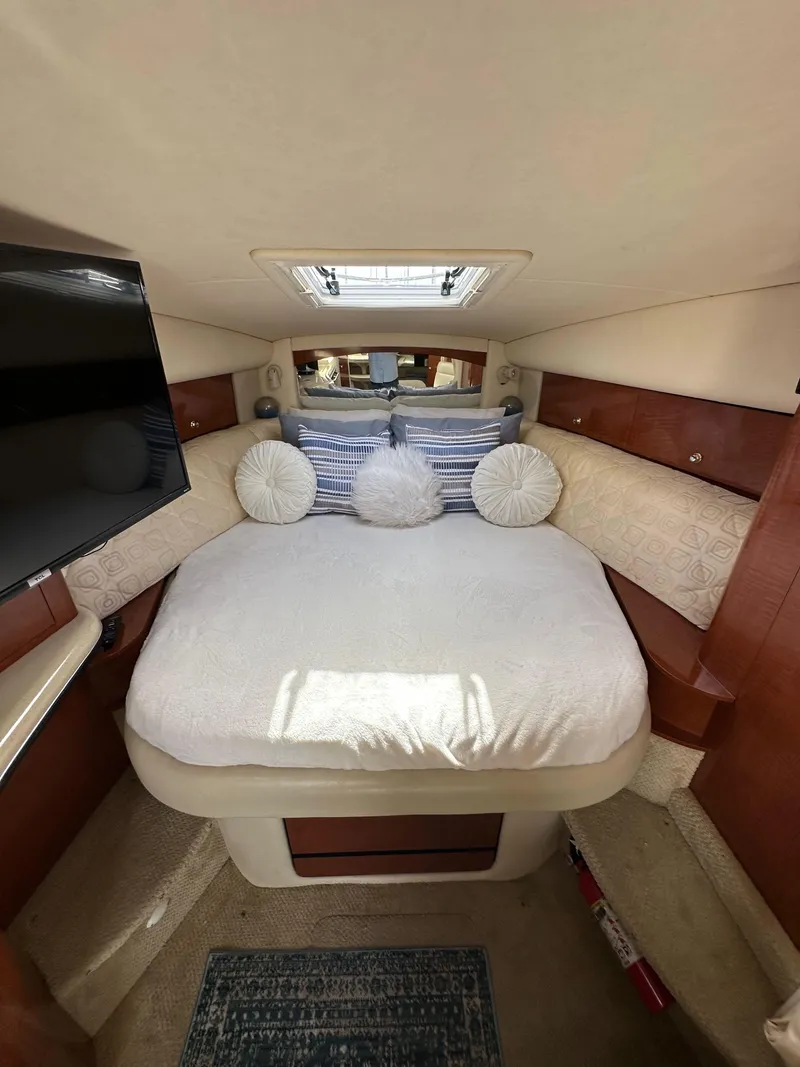 Slide: The Image of Interior of 2003 Sea Ray 320 Sundancer with cozy bed and modern amenities. - 37